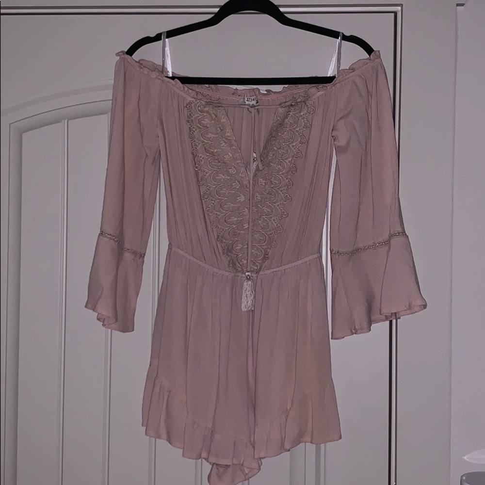 Pale pink romper w/ lace design and front tie
